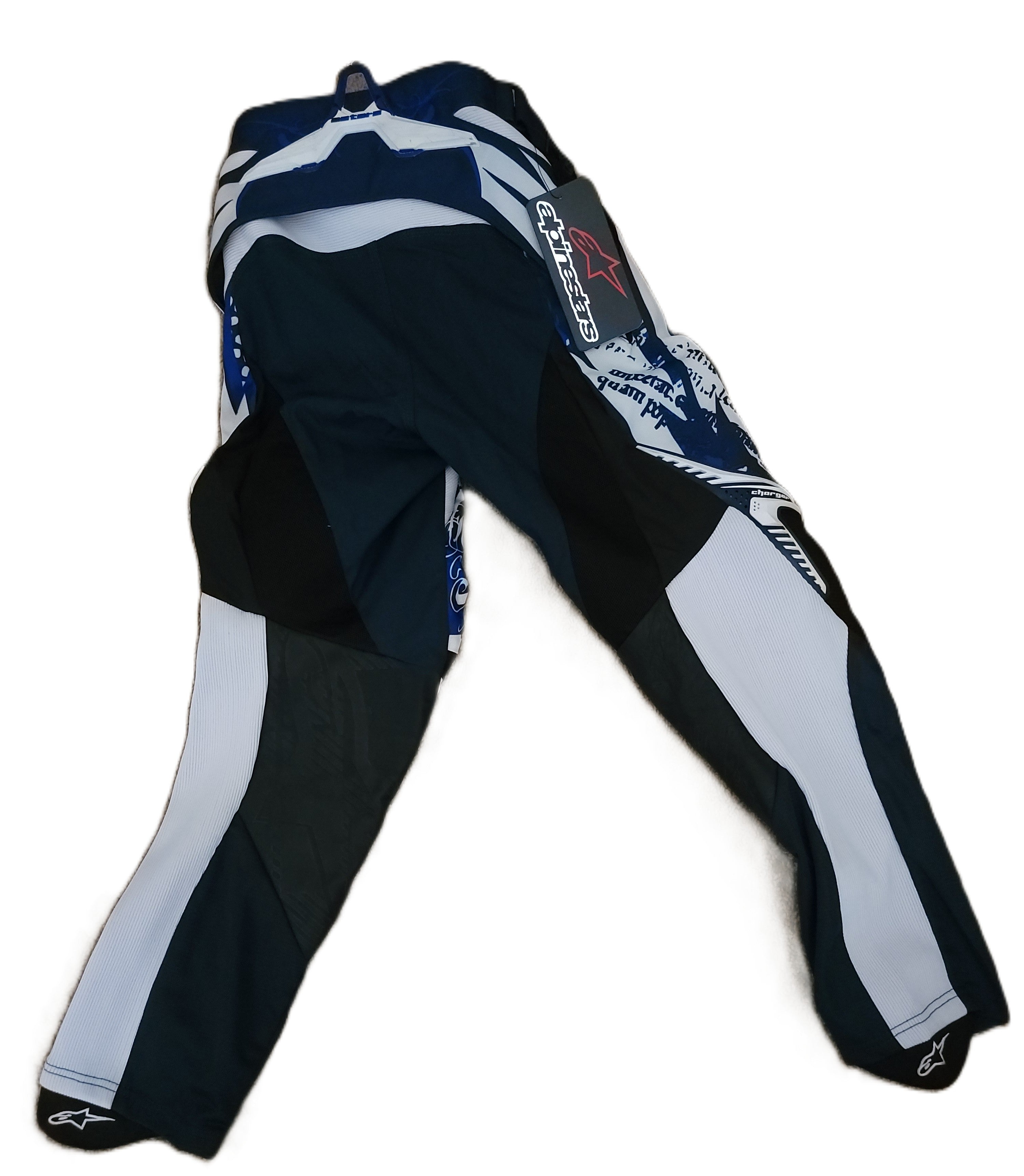 Black, white, and blue motocross pants with branding on a white background